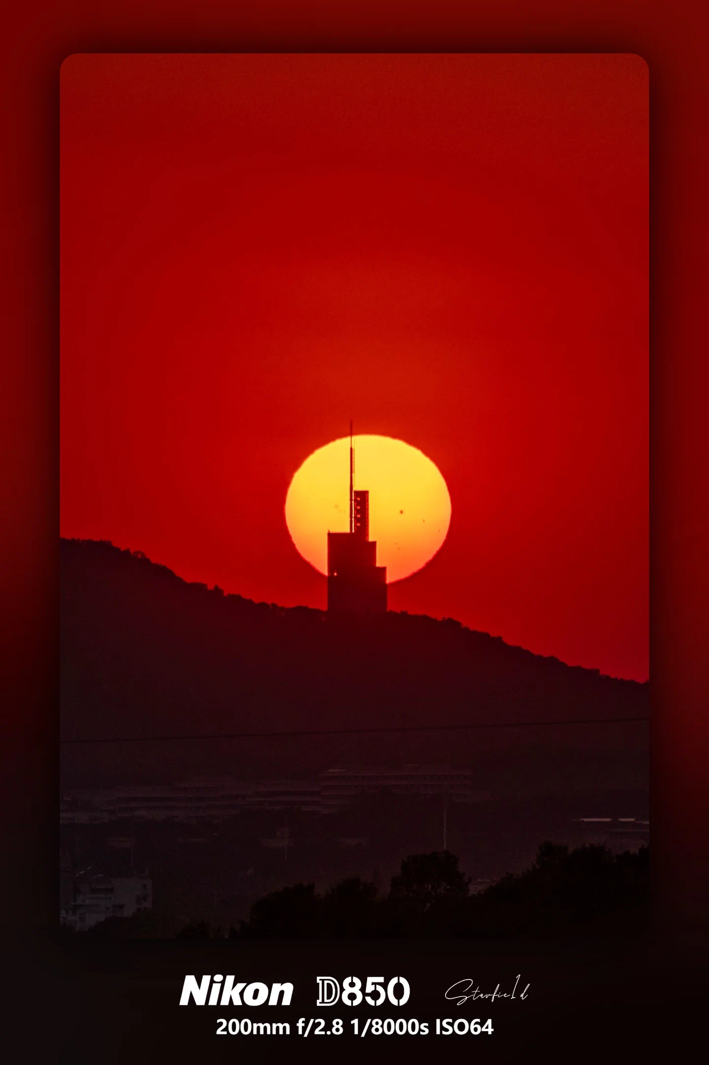 Sunspots and Zifeng Tower at Sunset
